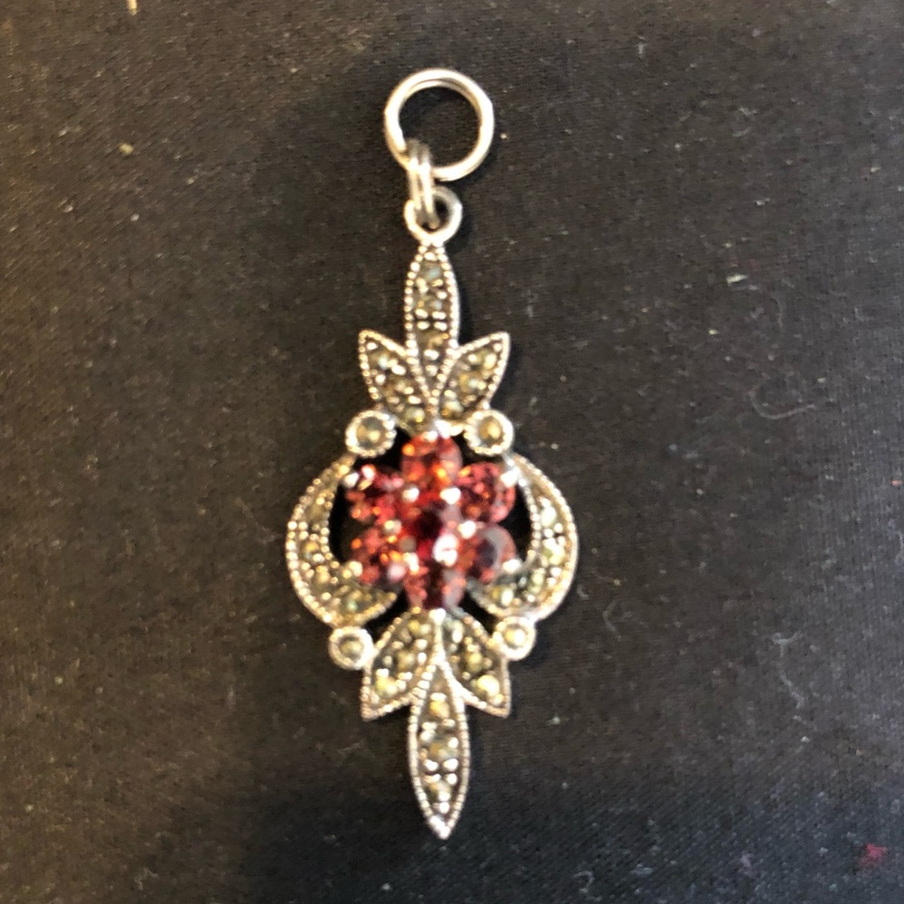 Red and silver pendant in flower shape